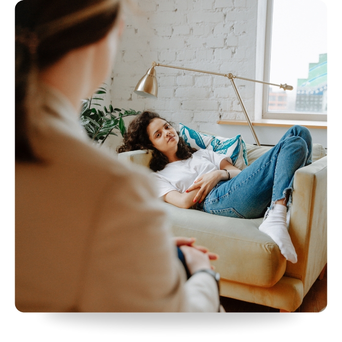 girl laying on couch during counseling session