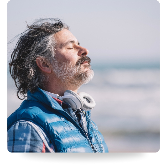 man breathing in fresh air